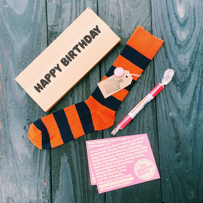 The Lanes Gift Box - orange stripy socks, Brighton rock and free merch!